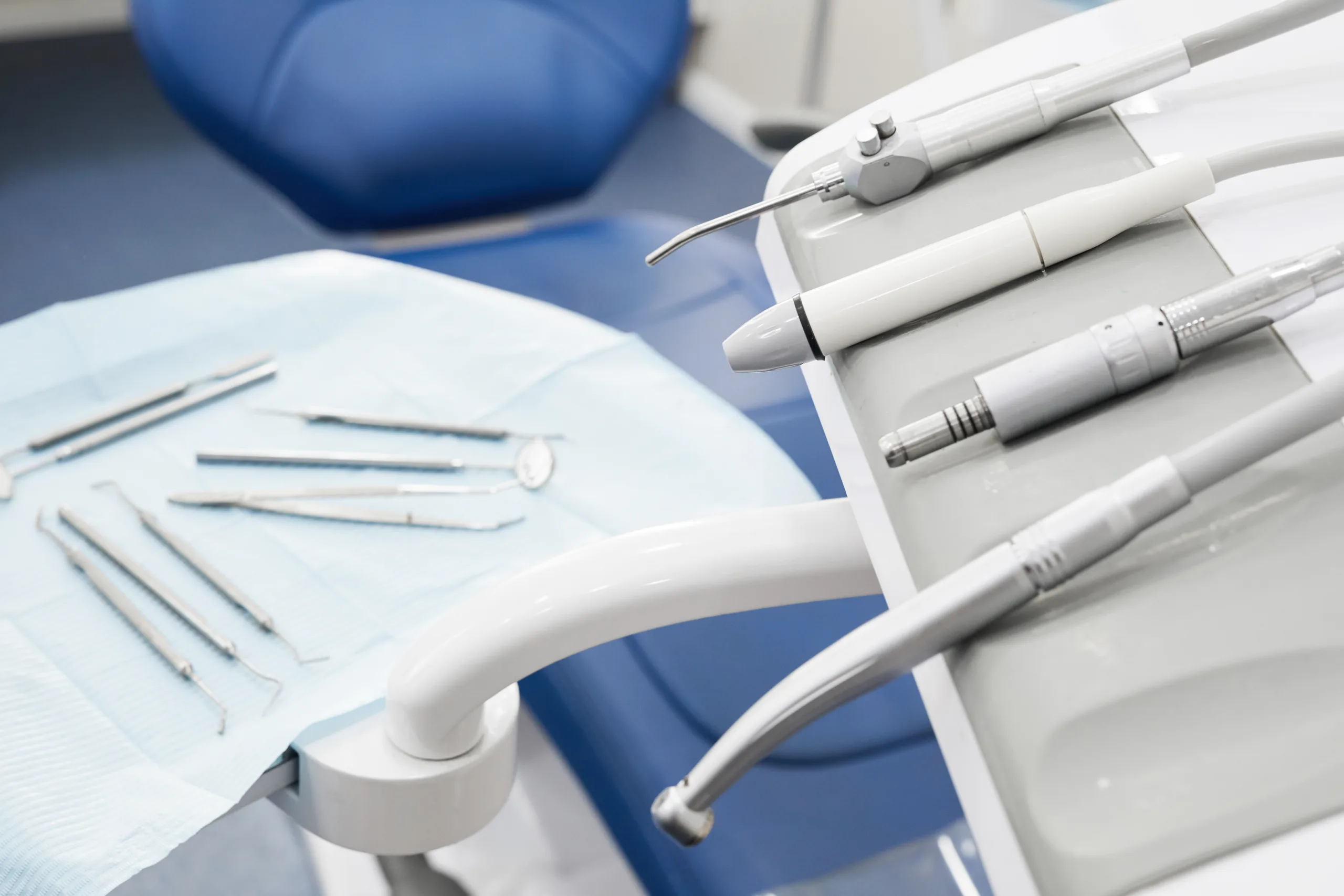 Dental instruments beside a treatment chair